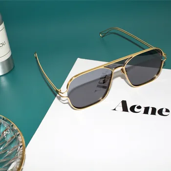 Nueva gama alta de lujo gafas de sol de mujer fresco concepto de diseño de dos colores gafas de color hueco gafas de sol de montura macho，uv400